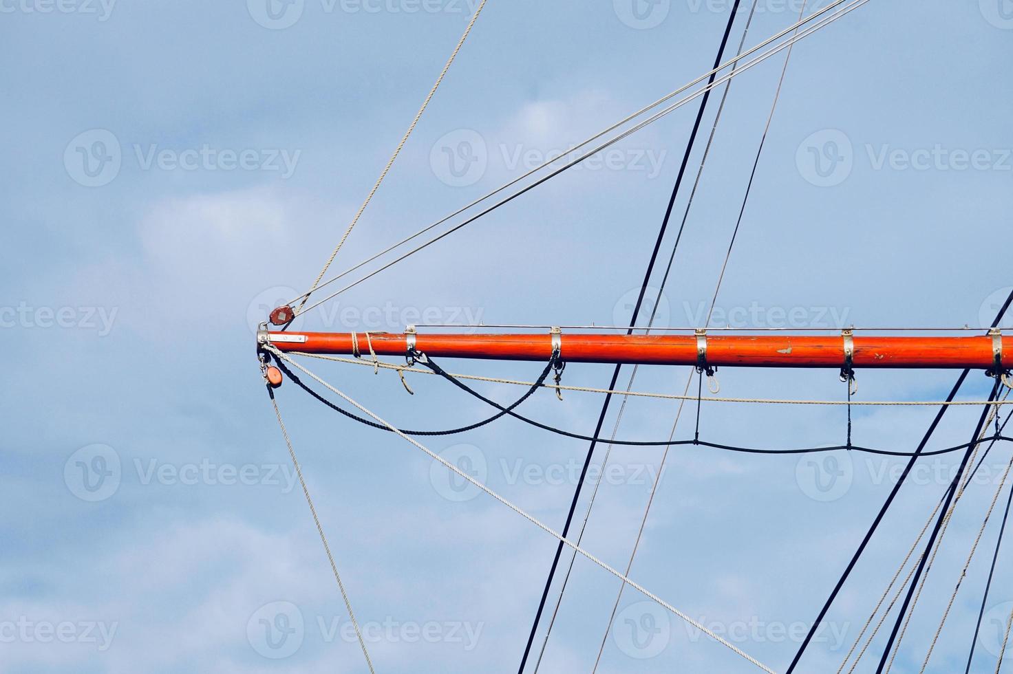 sailboat wooden mast in the seaport photo