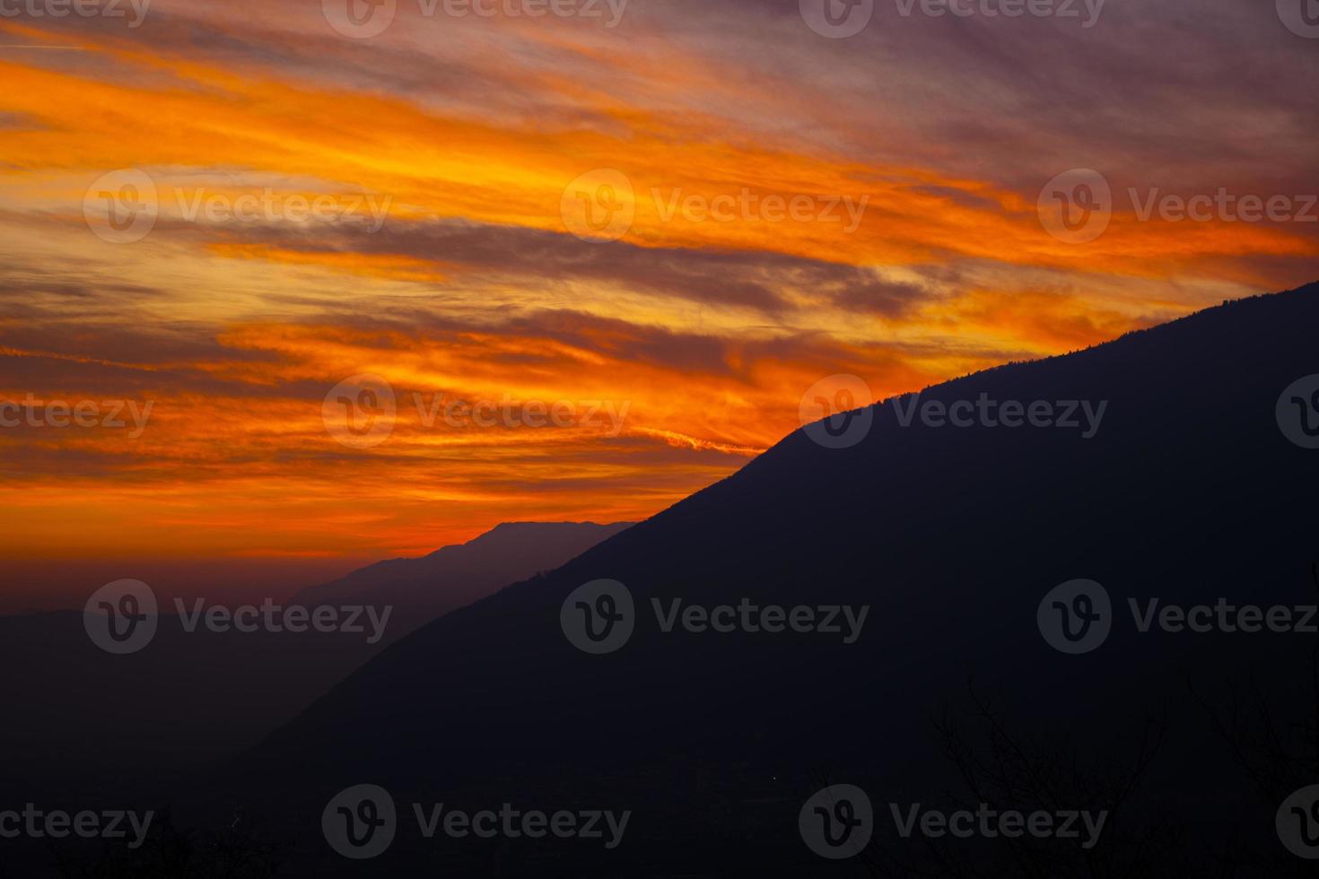 Orange sunset and mountains photo