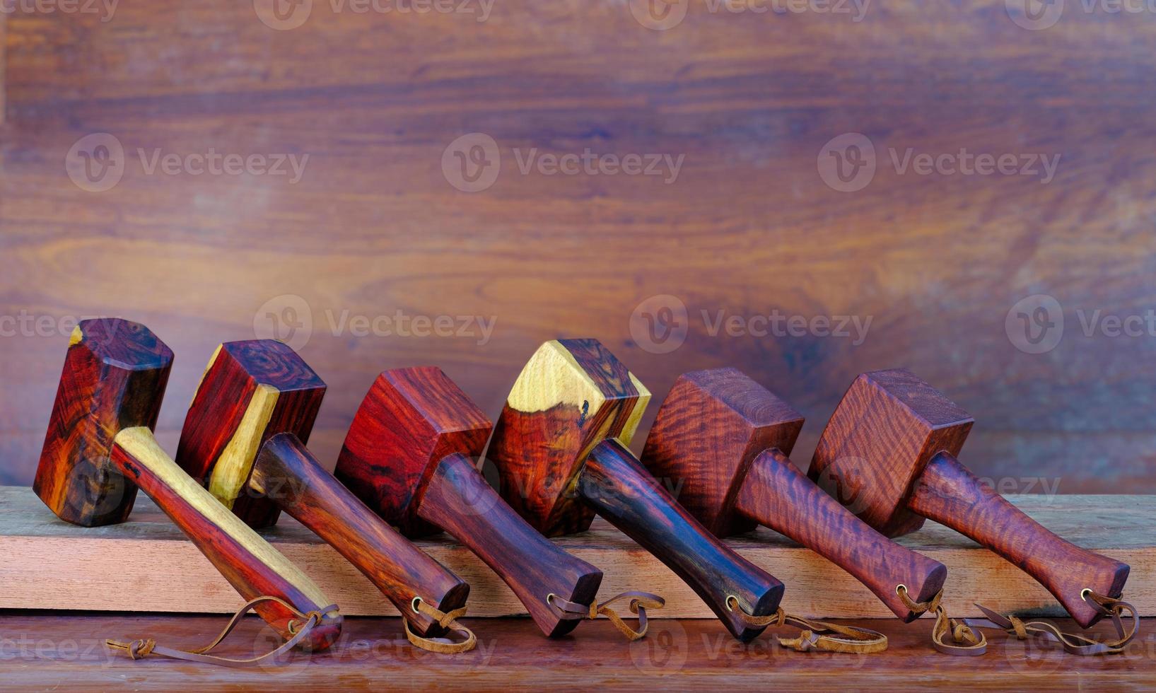 Set of mallet hammer wood made of rosewood tool handmade of Thailand for used by a carpenter in the workshop on the old workbench photo