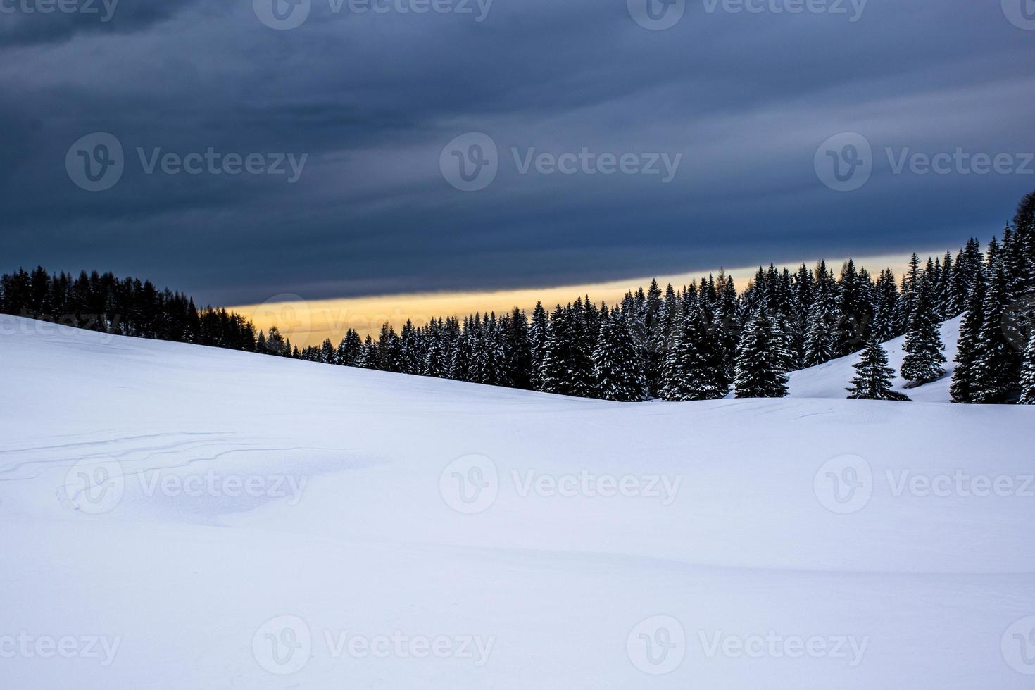 Alpine snowy landscape at sunset photo