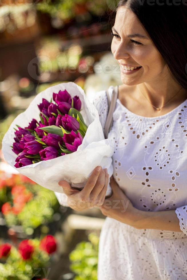 Young woman buying flowers at the flower market 2572273 Stock Photo at