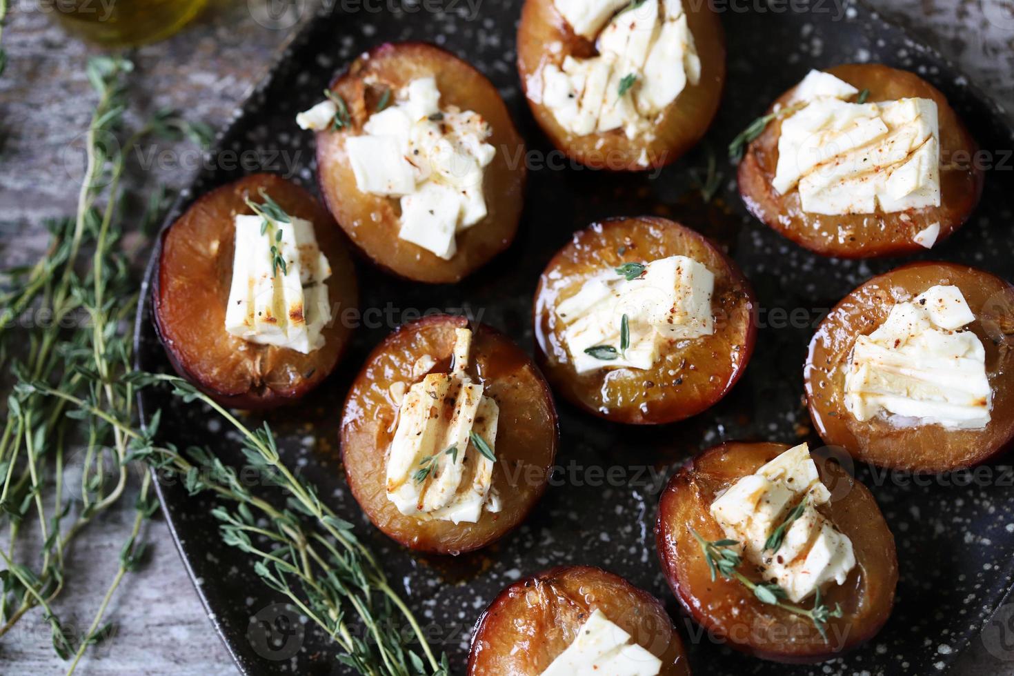 Baked plums with feta cheese photo
