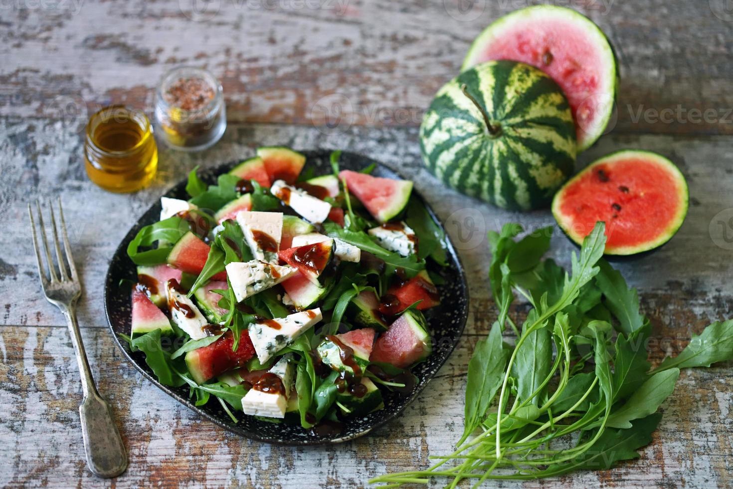 Watermelon salad with arugula and gorgonzola cheese photo