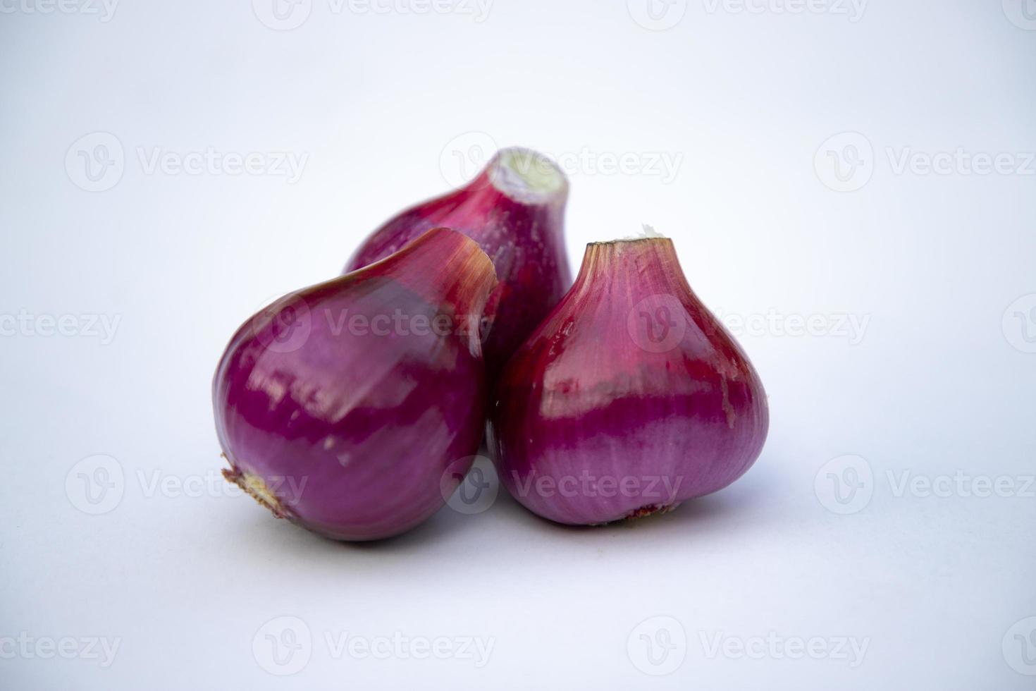 Red onion isolated on white background close up photo shoot