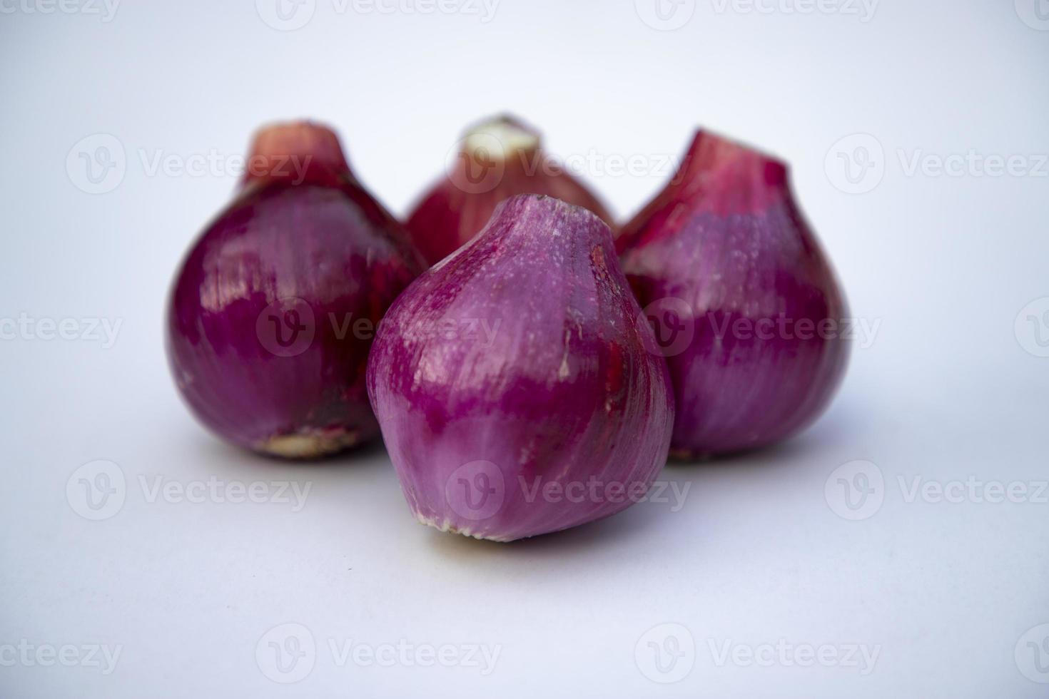 Red onion isolated on white background close up photo shoot