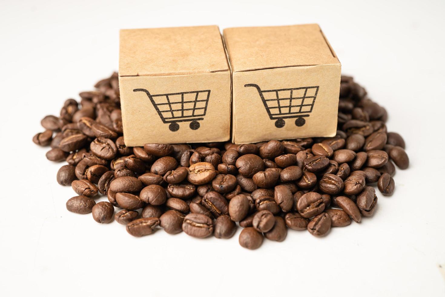 Box with shopping cart logo symbol on coffee beans import Export concept photo