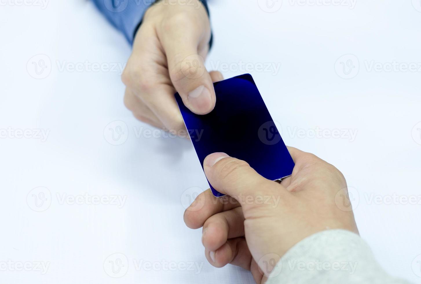 Hand paying credit card with staff cashier photo