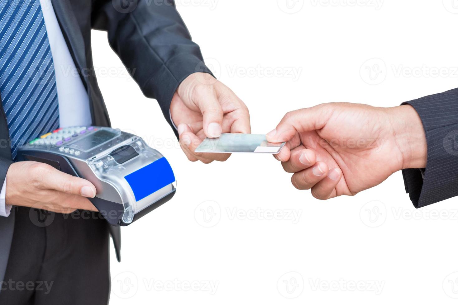 Businessman are accepting credit card from customer by paying via receipt printer photo