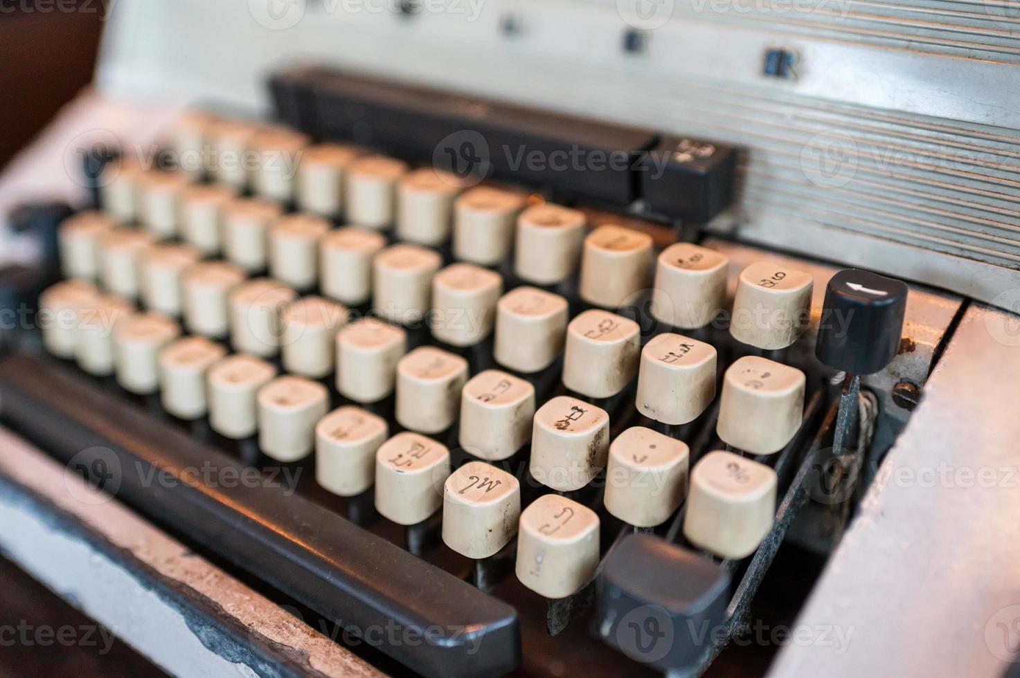 Obsolete classic typewriter with Thai keyboard photo