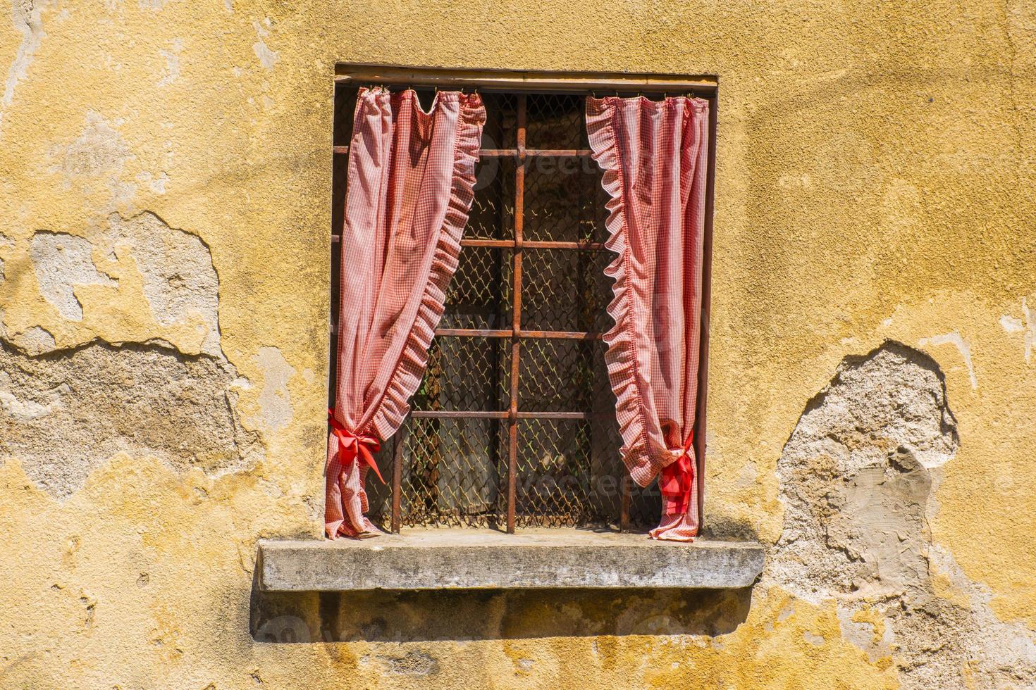 Old window with curtains photo