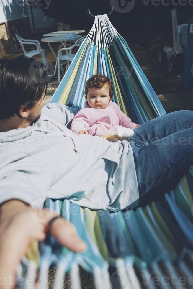Little baby enjoying a sunny day in holidays with dad photo