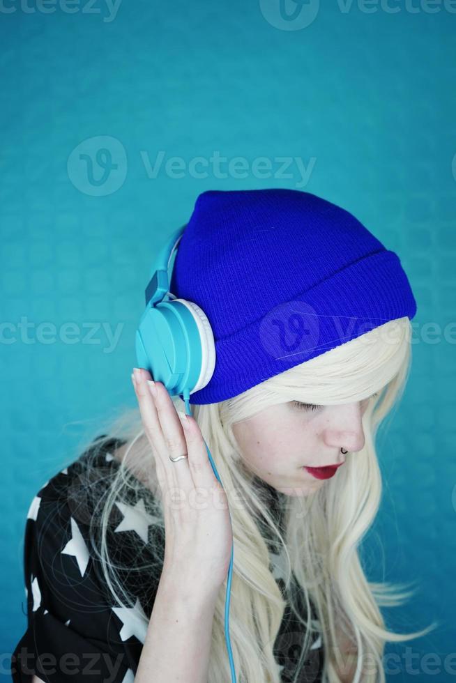 Beautiful blonde woman listening to music photo