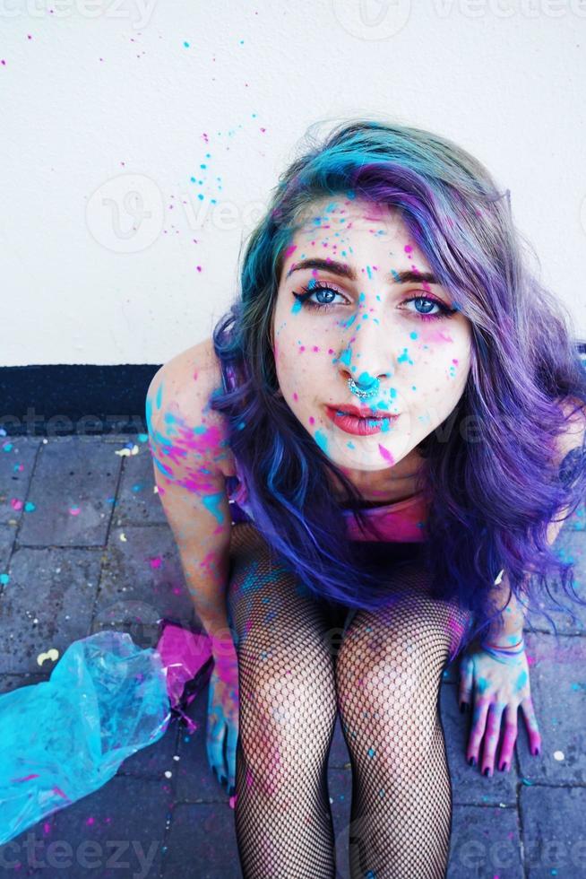 Young woman with paint in her skin photo