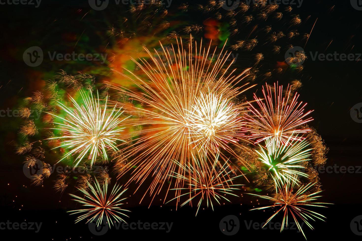 Bright fireworks on a festive night Colored lights in the dark sky for a holiday photo