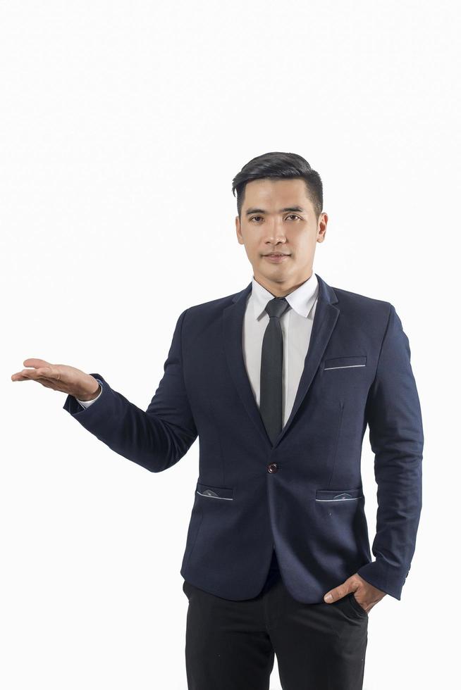 Handsome businessman showing something isolate on white background photo