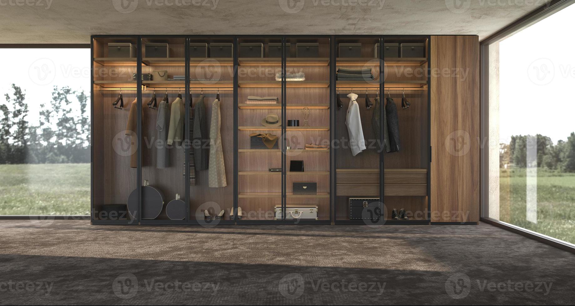 Diseño de interiores moderno de lujo gran armario de madera con ropa colgada en el riel en el vestidor y la iluminación de estantes foto
