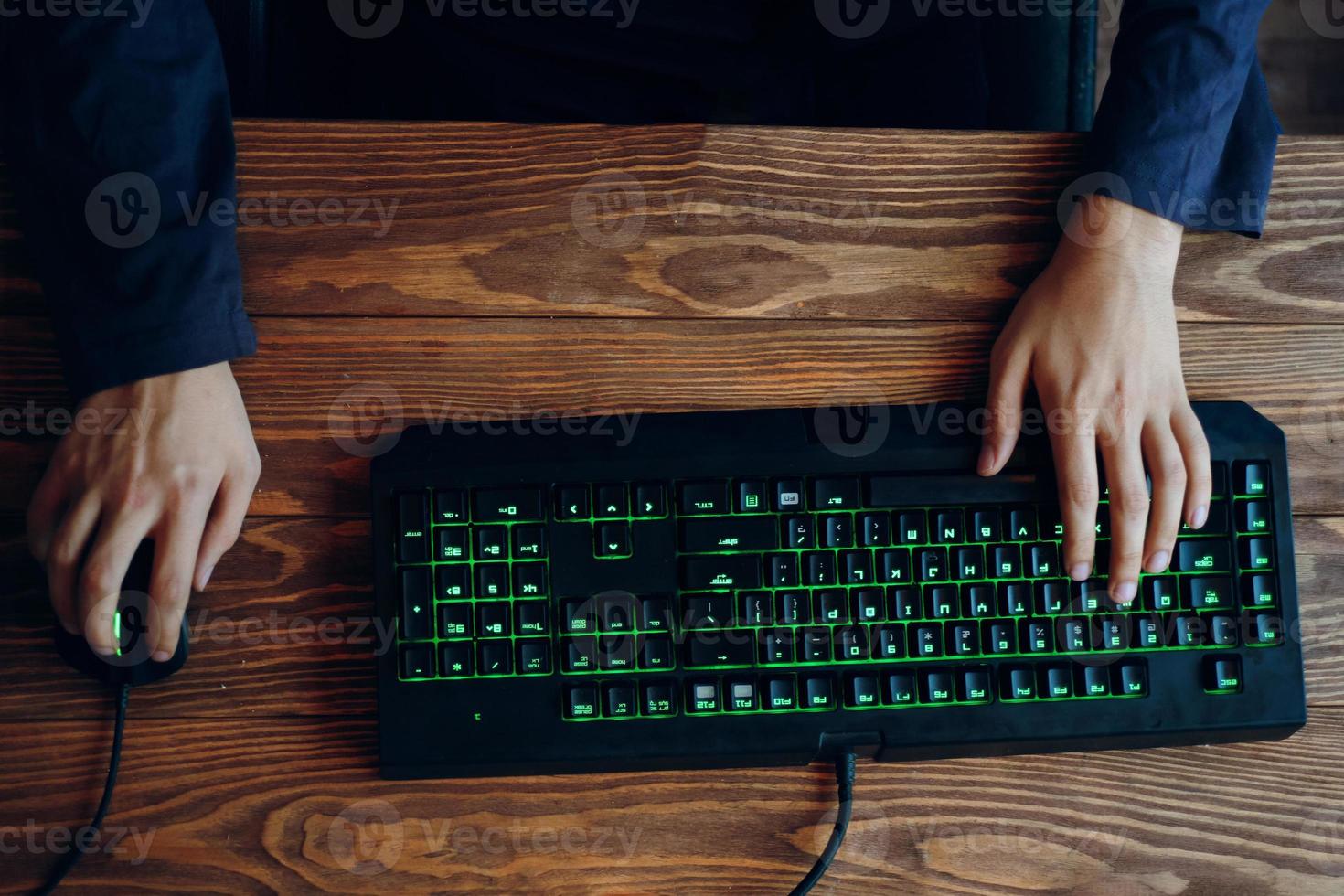 Top view Gamer uses gaming mouse and keyboard while playing games photo
