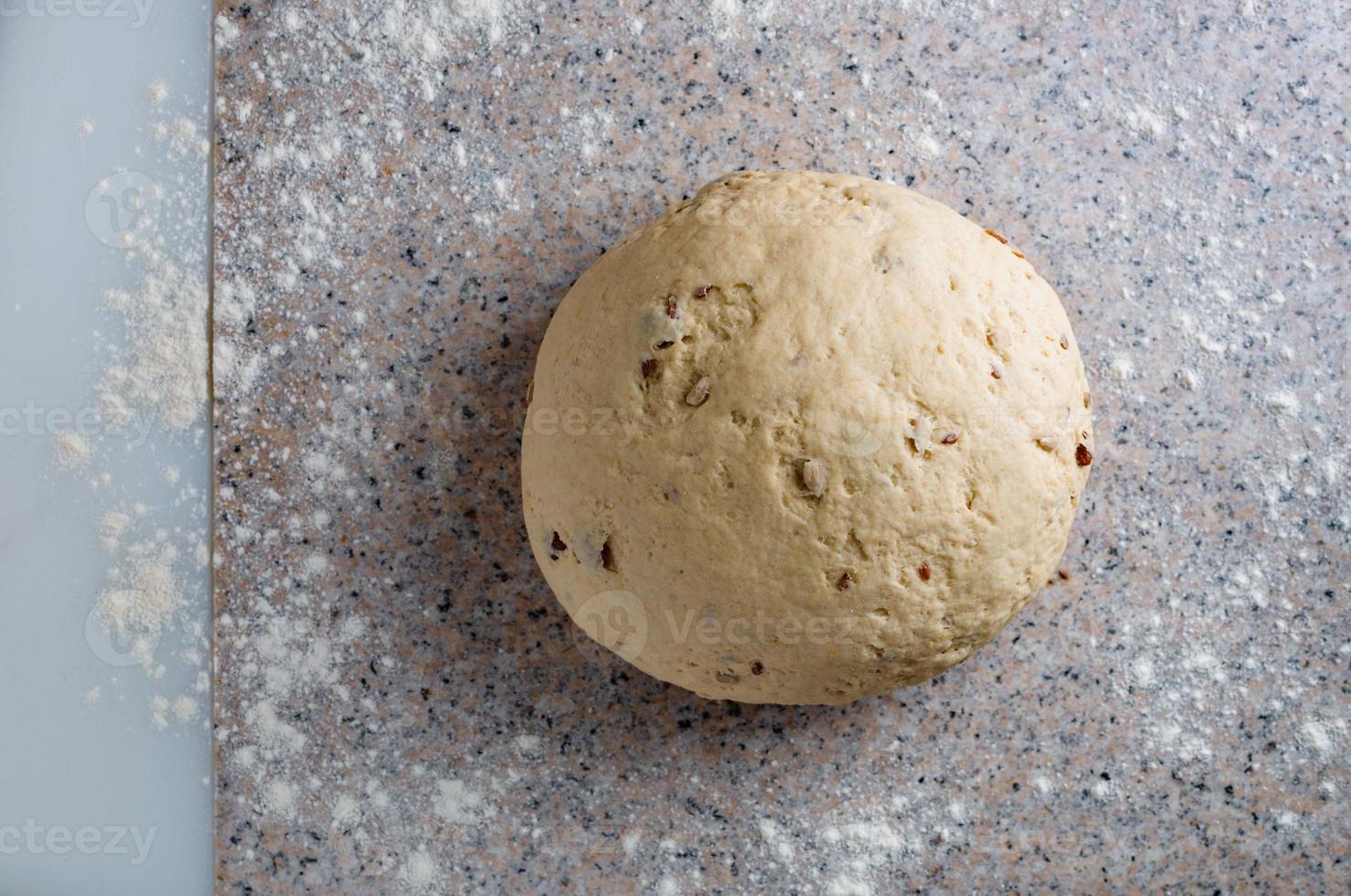 Homemade dough, semisweet dough with raisins, honey and  various seeds photo