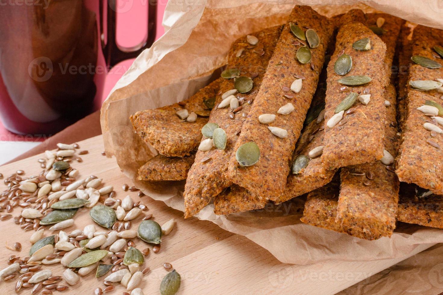 Cereal bars with different seeds. Whole grains bars with honey,a very healthy snack to boost energy. photo