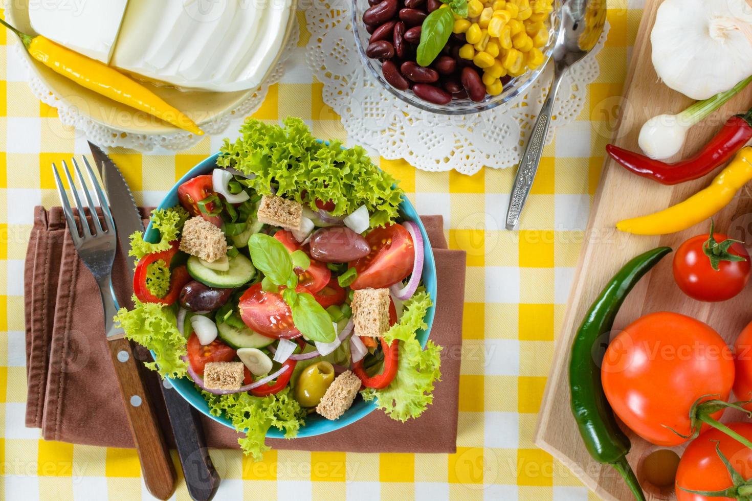 Fresh vitaminic green salad with bread cubes and tasty selection of vegetables. photo