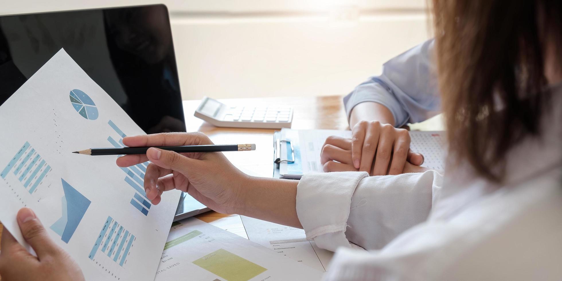 Close up of businesspeople meeting to discuss the situation in the market. Business financial concept photo