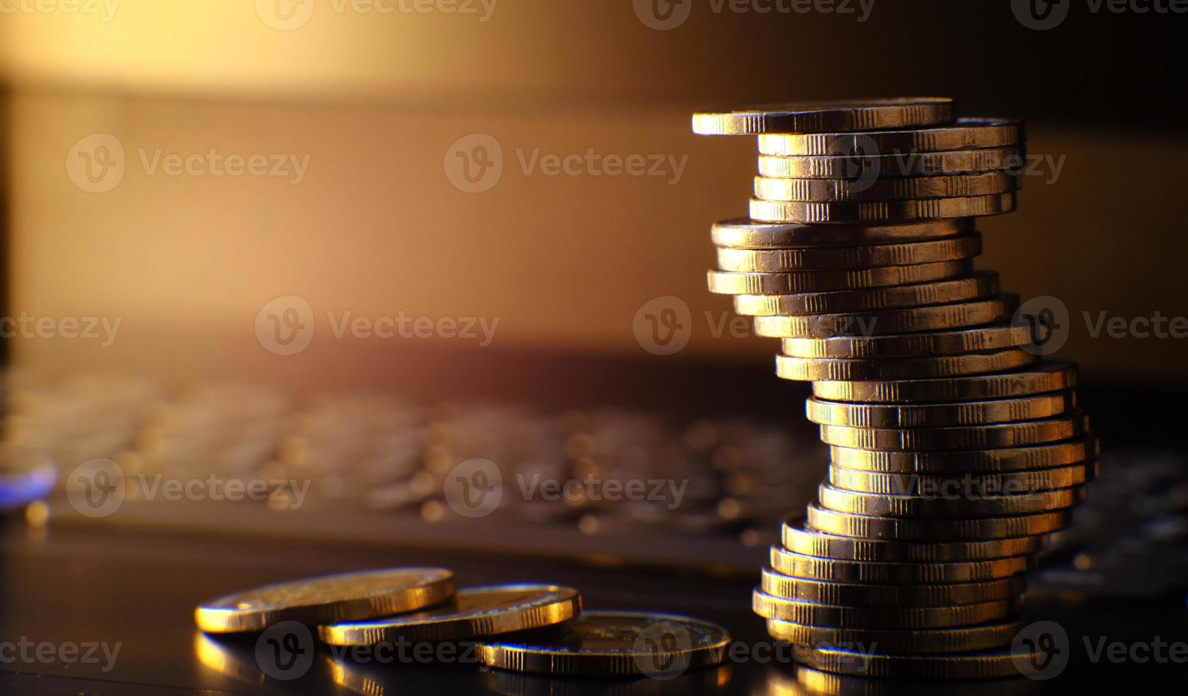 Saving money concept, stacking coins on table background, advertising coins of finance and banking, macro coins photo