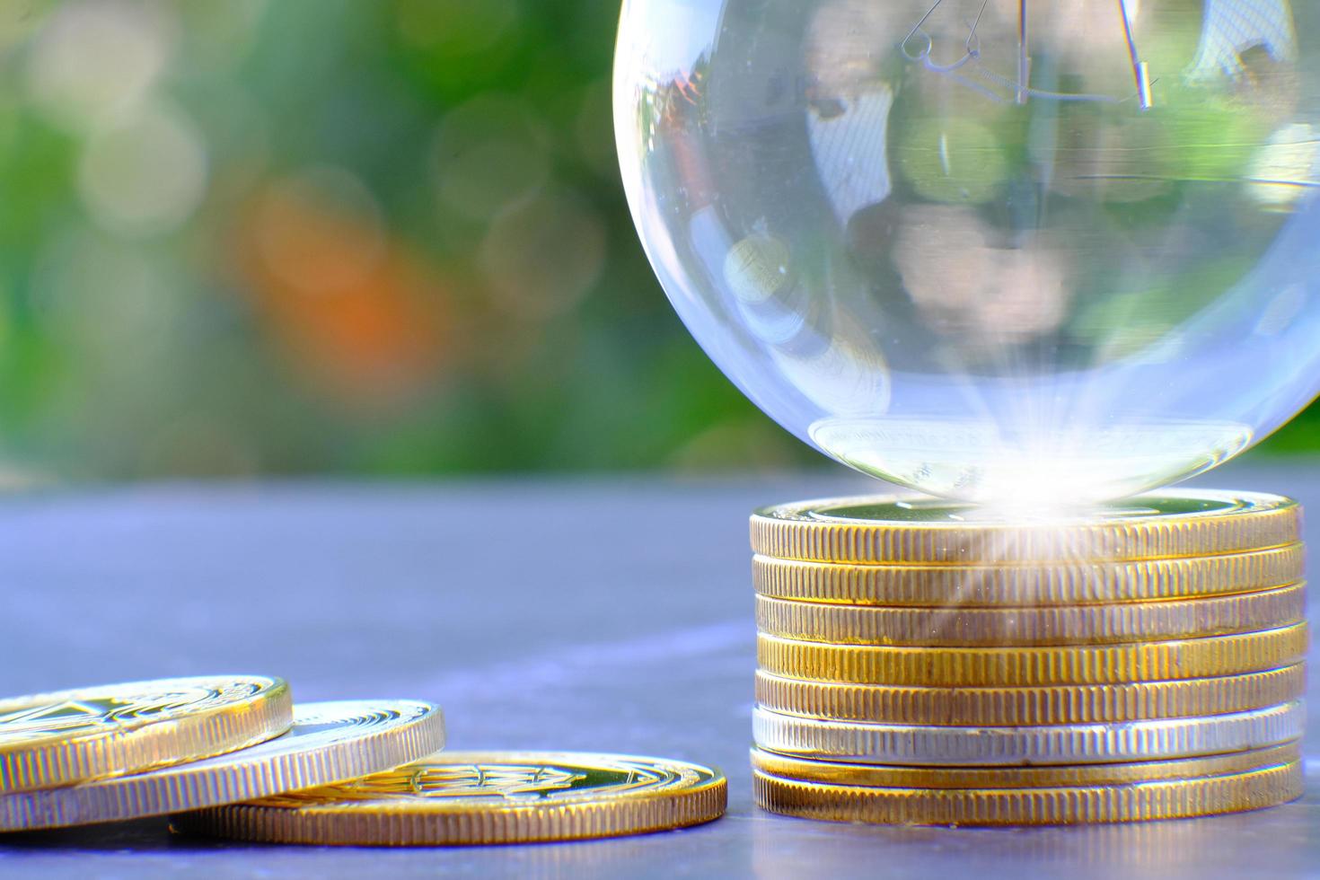 A illustration of a globe on a stack of coins photo