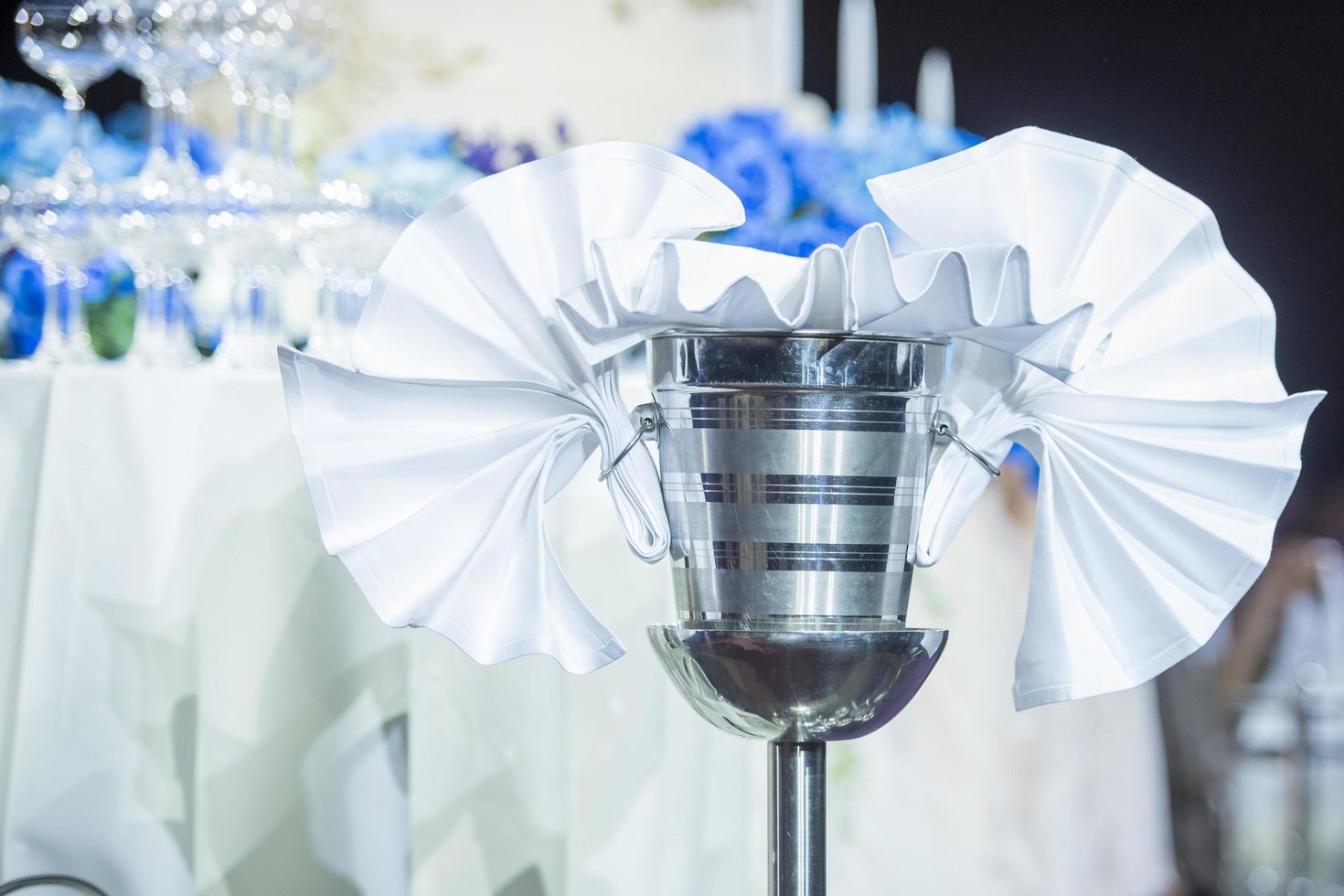 Rows of champagne glasses in wedding party photo