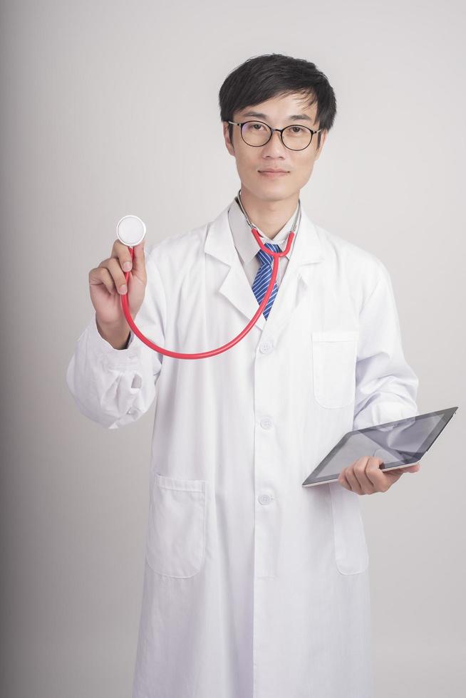 Medicine doctor hand holding stethoscope and working photo