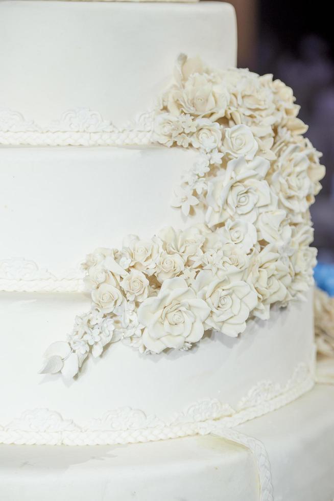 White wedding cake with flower photo