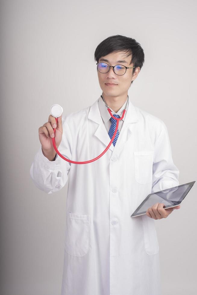 Medicine doctor hand holding stethoscope and working photo