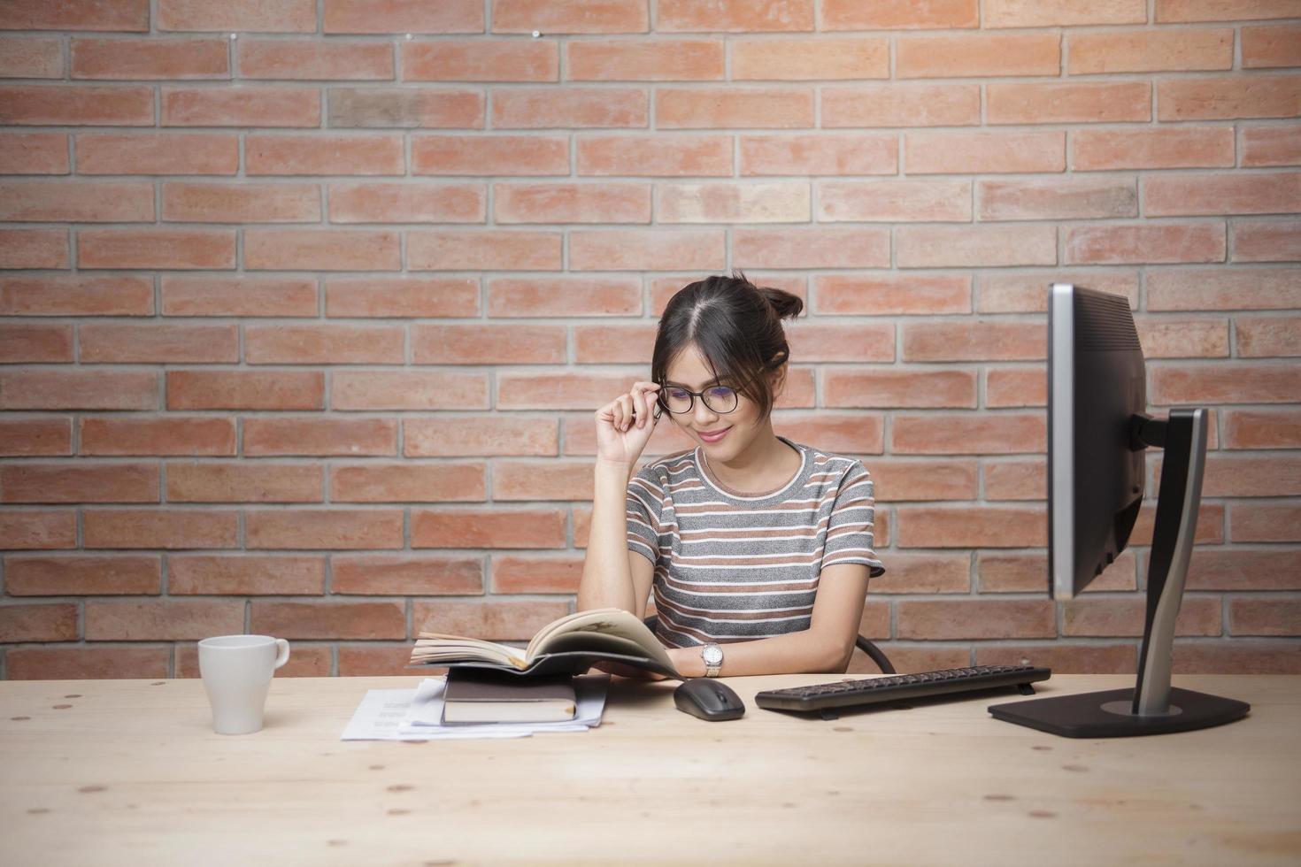 Beautiful woman is working in home office photo