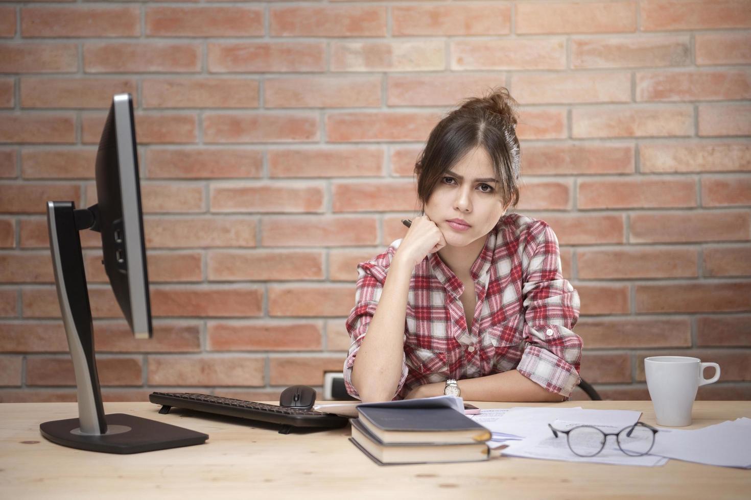 Asian women are stressed out of work photo