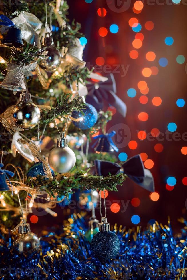 Christmas decorations on tree branch on bokeh background photo