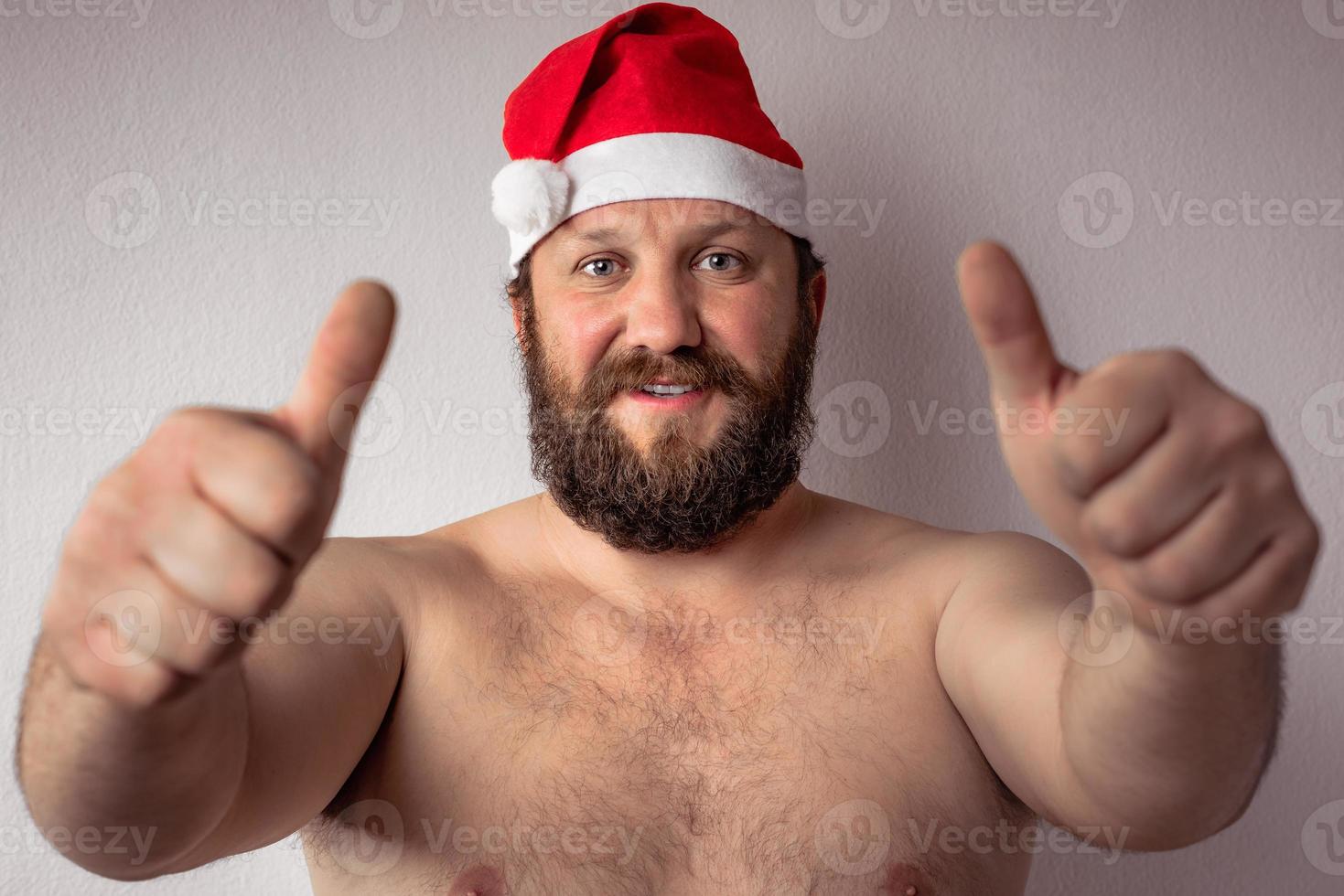 Bearded half-naked Santa Claus man photo