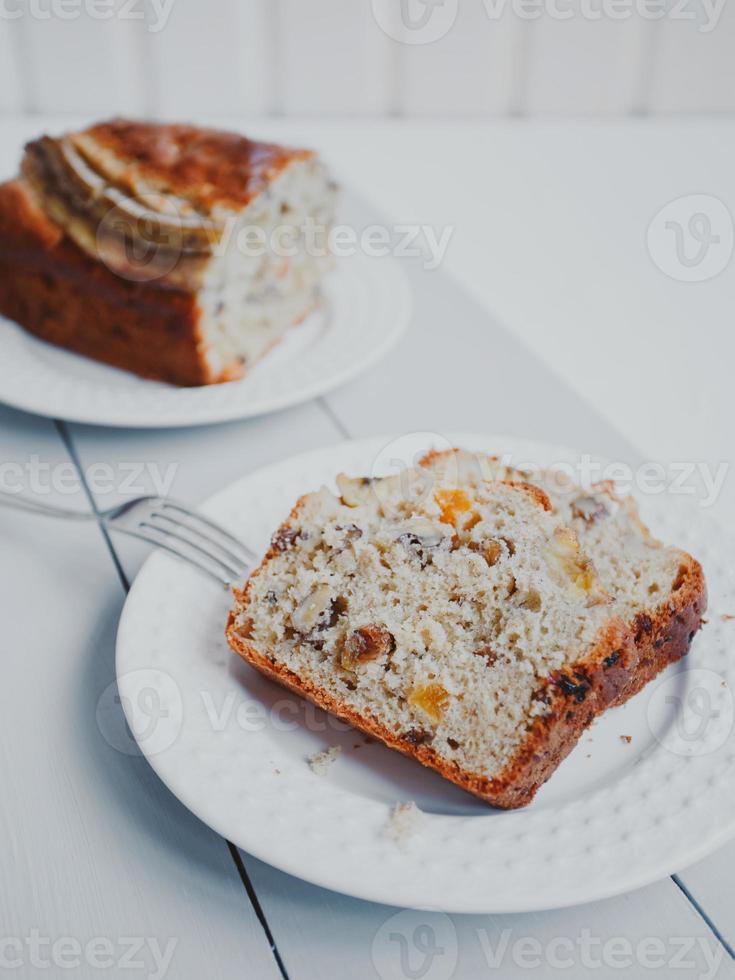 Homemade banana bread with dried fruits and walnuts. photo