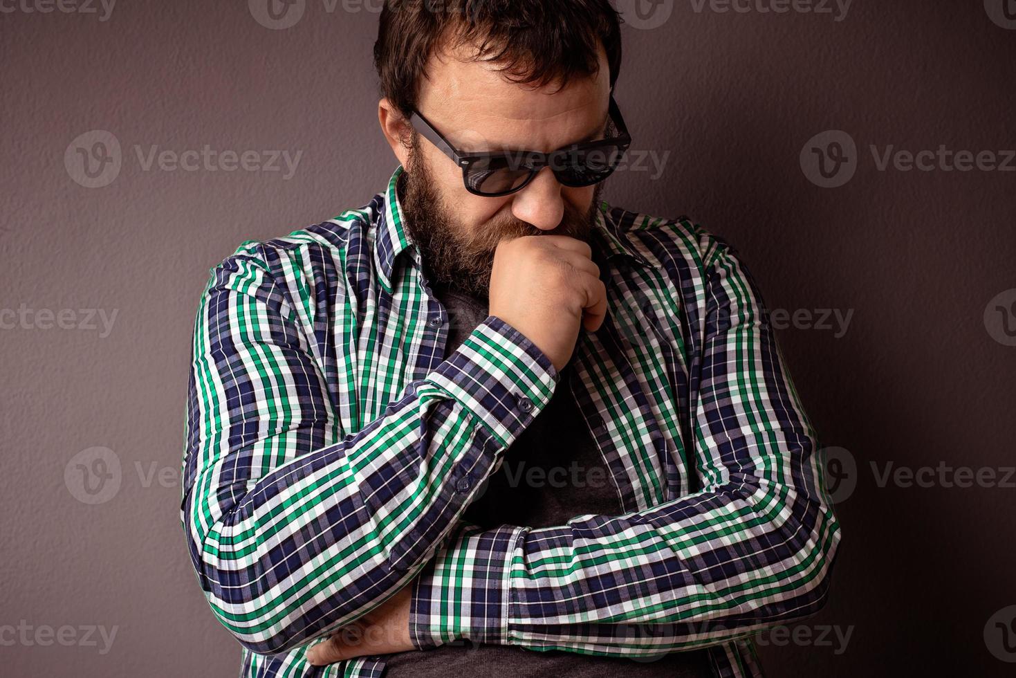 Handsome hipster bearded man with sunglasses and shirt photo