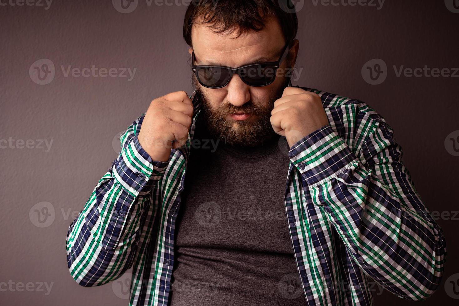 Handsome hipster bearded man with sunglasses and shirt photo