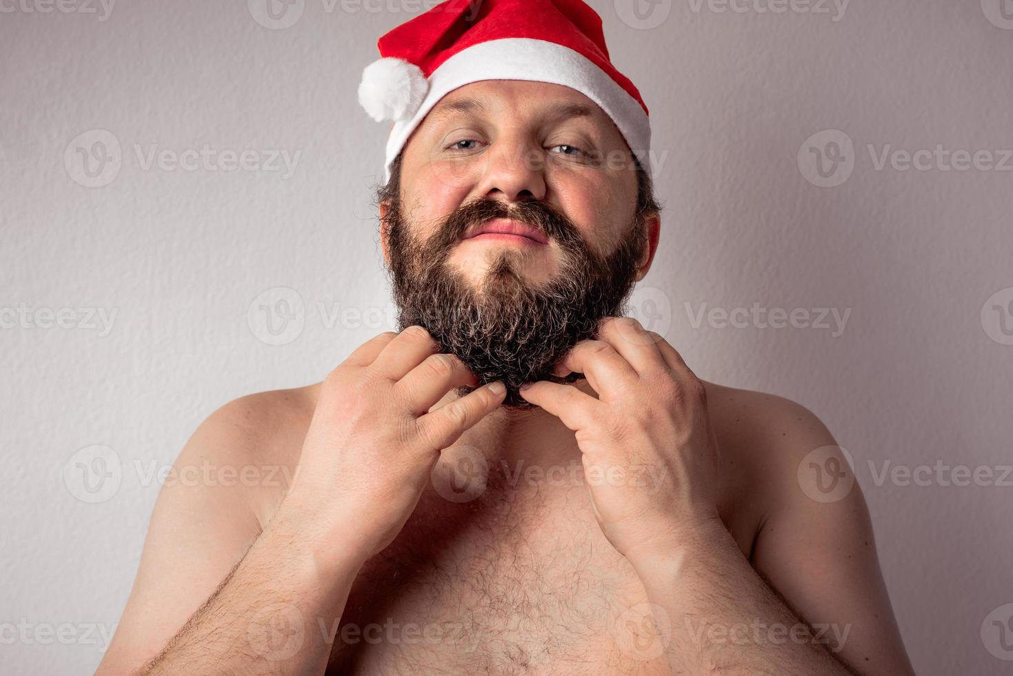 Bearded half-naked Santa Claus man photo