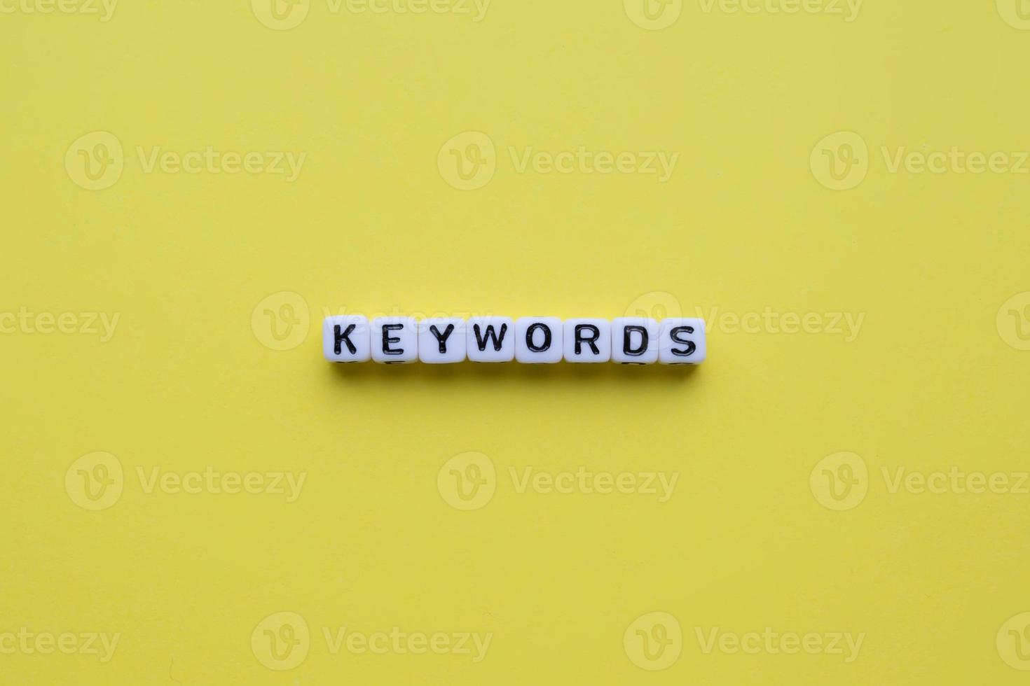 Keywords word on yellow background. photo