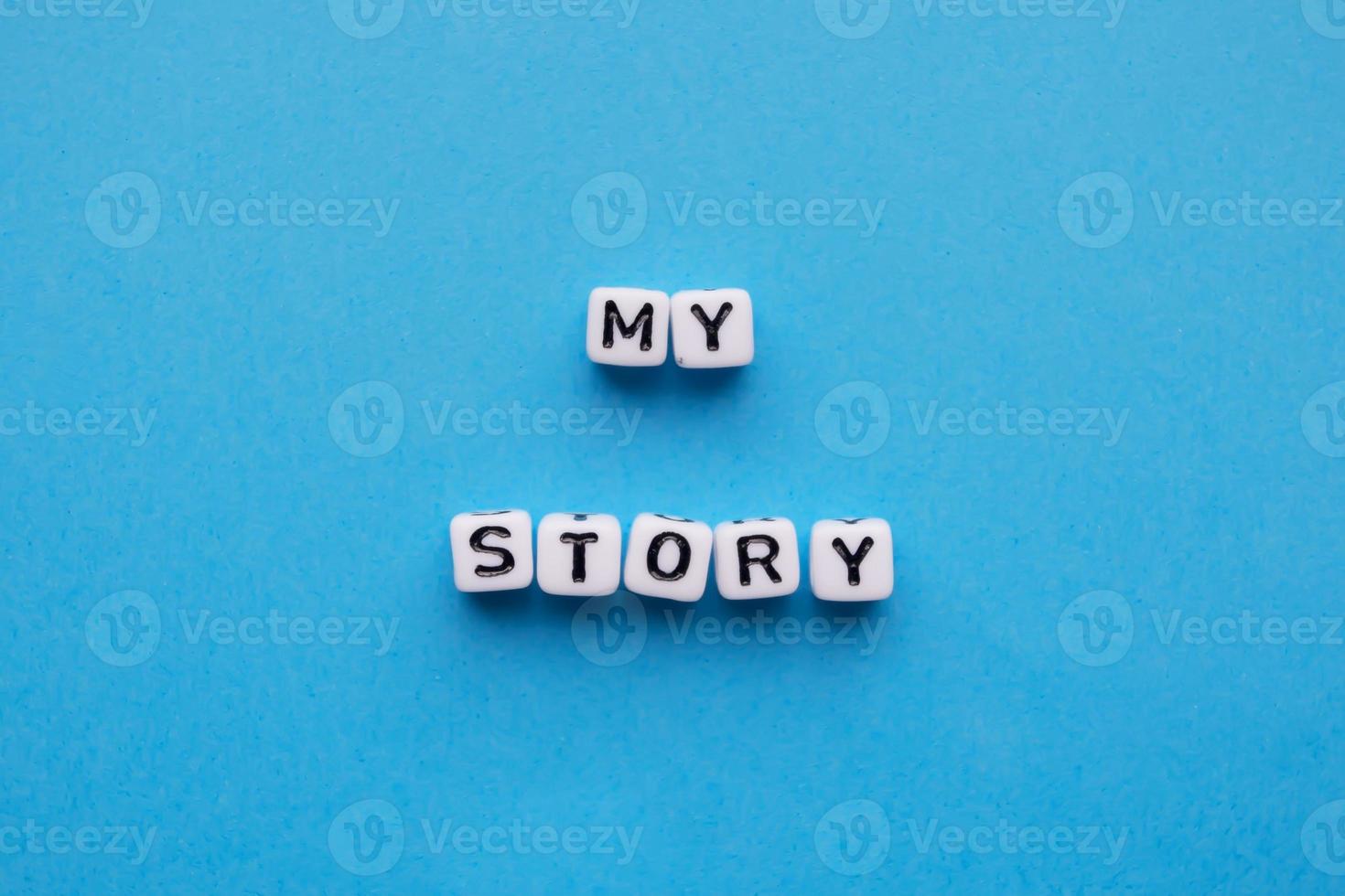 My story word cubes on a blue background photo