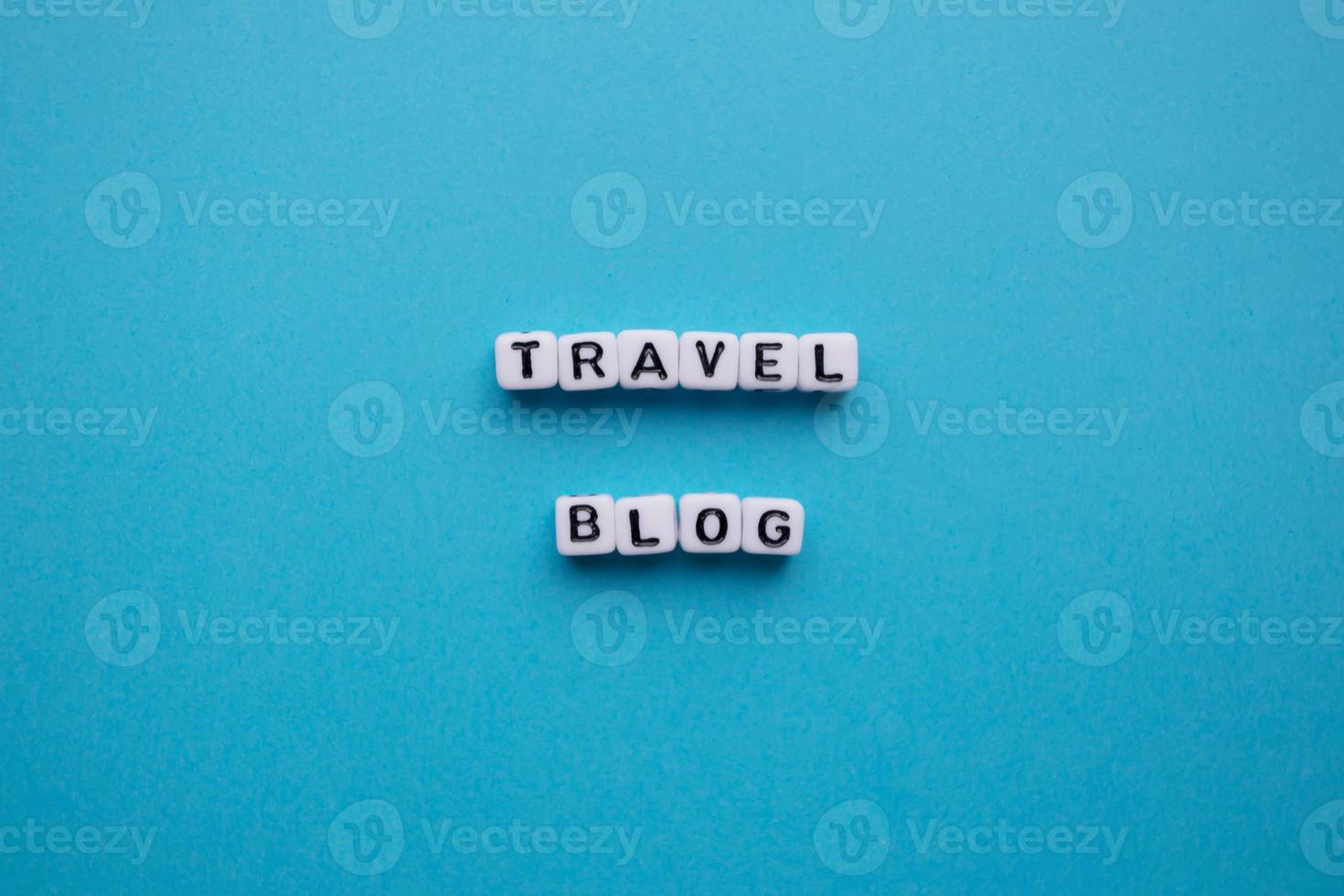 Travel blog words on a blue background photo