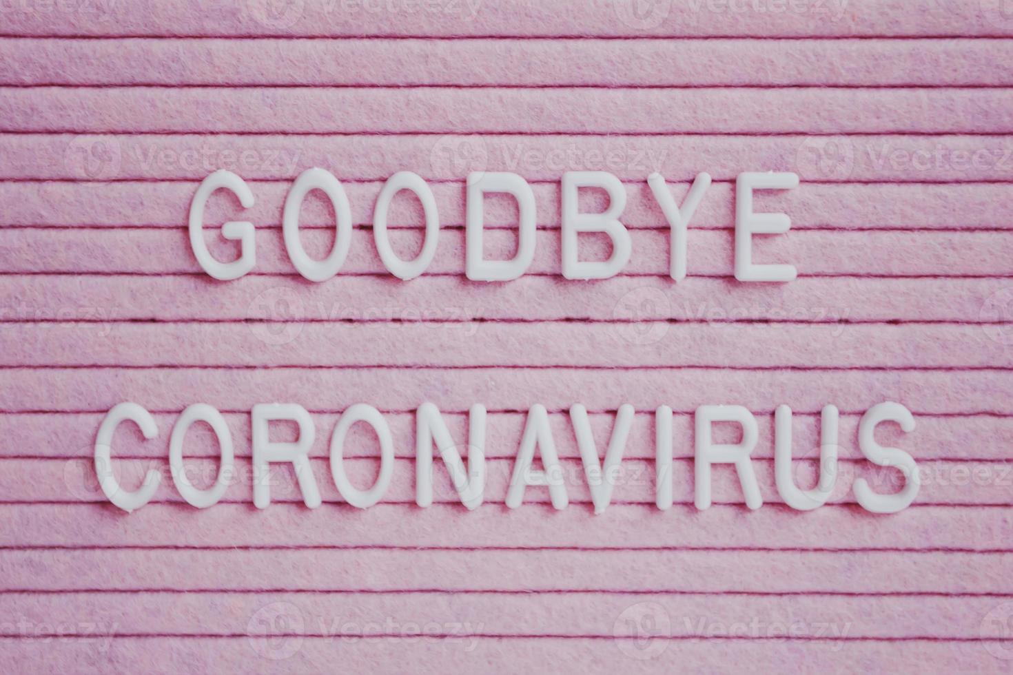 Goodbye Coronavirus, on a pink background photo