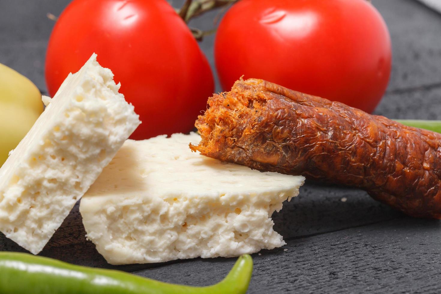 Raw rustic meal farm fresh vegetables cheese and cabbage photo