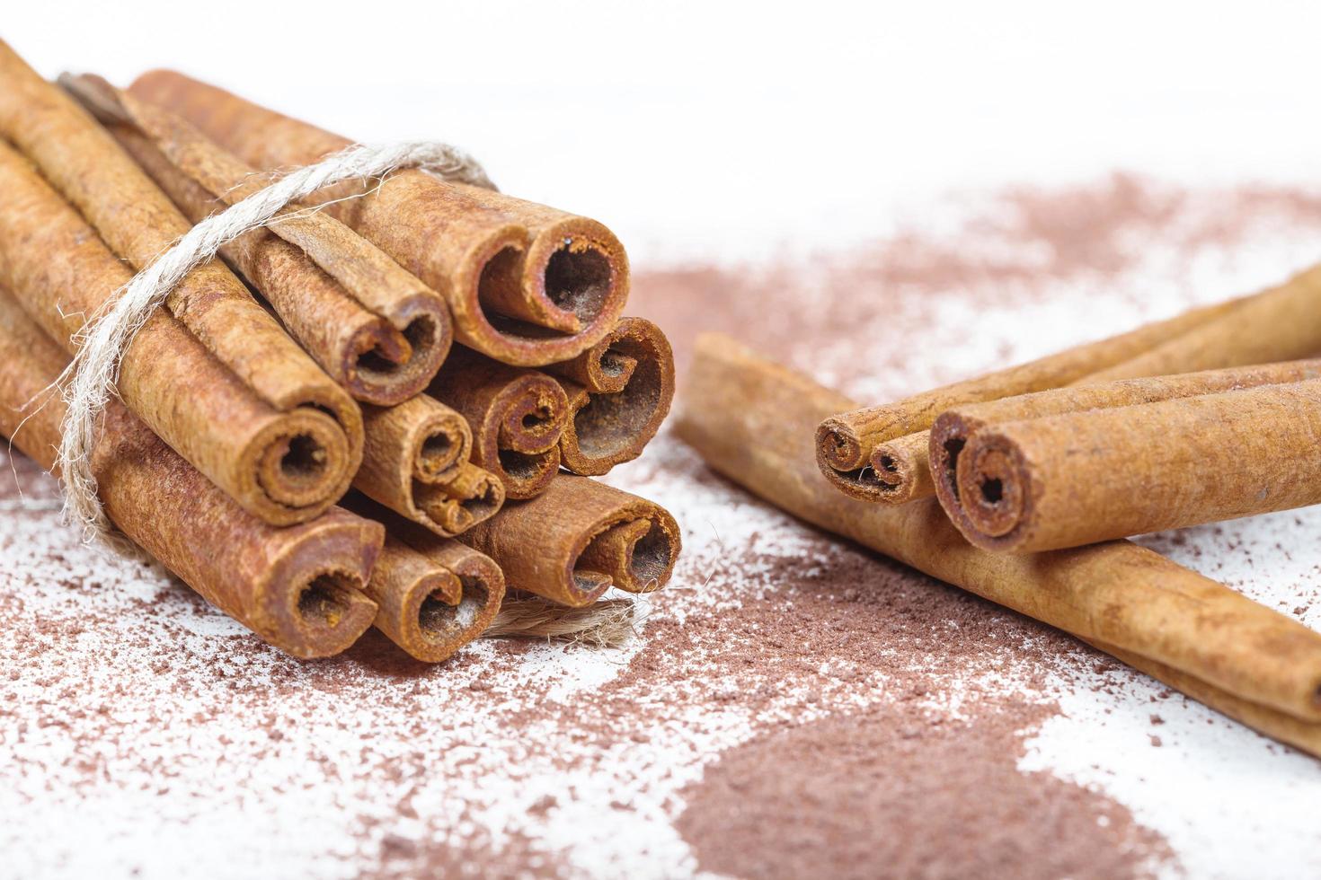 Cinnamon sticks and cocoa powder accessories for a cozy winter evening near the fireplace with a glass of wine photo