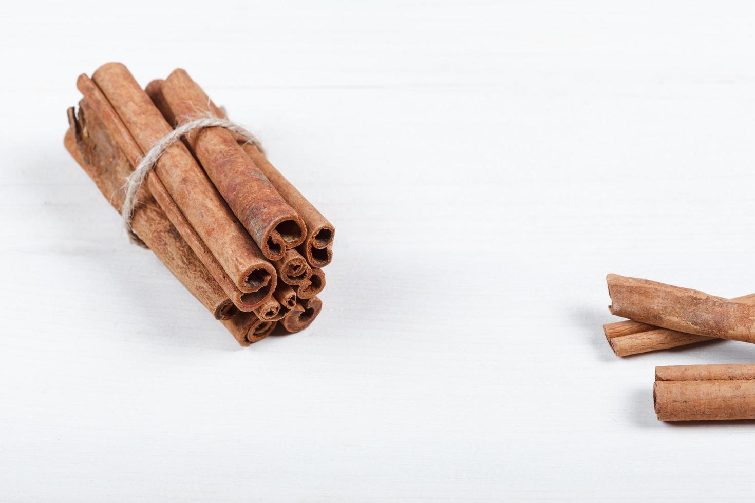 Cinnamon sticks and cocoa powder accessories for a cozy winter evening near the fireplace with a glass of wine photo