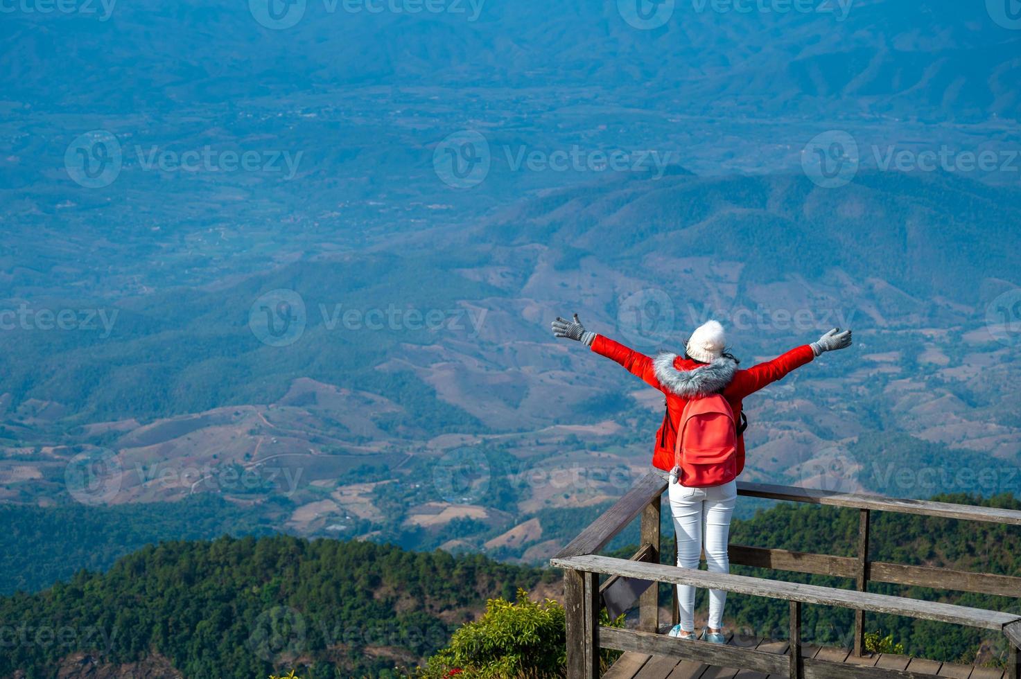 Young people walking on a hilltop in Doi Inthanon, Chiang Mai, Thailand photo