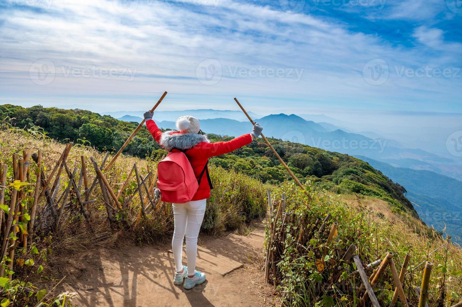 Young people walking on a hilltop in Doi Inthanon, Chiang Mai, Thailand photo