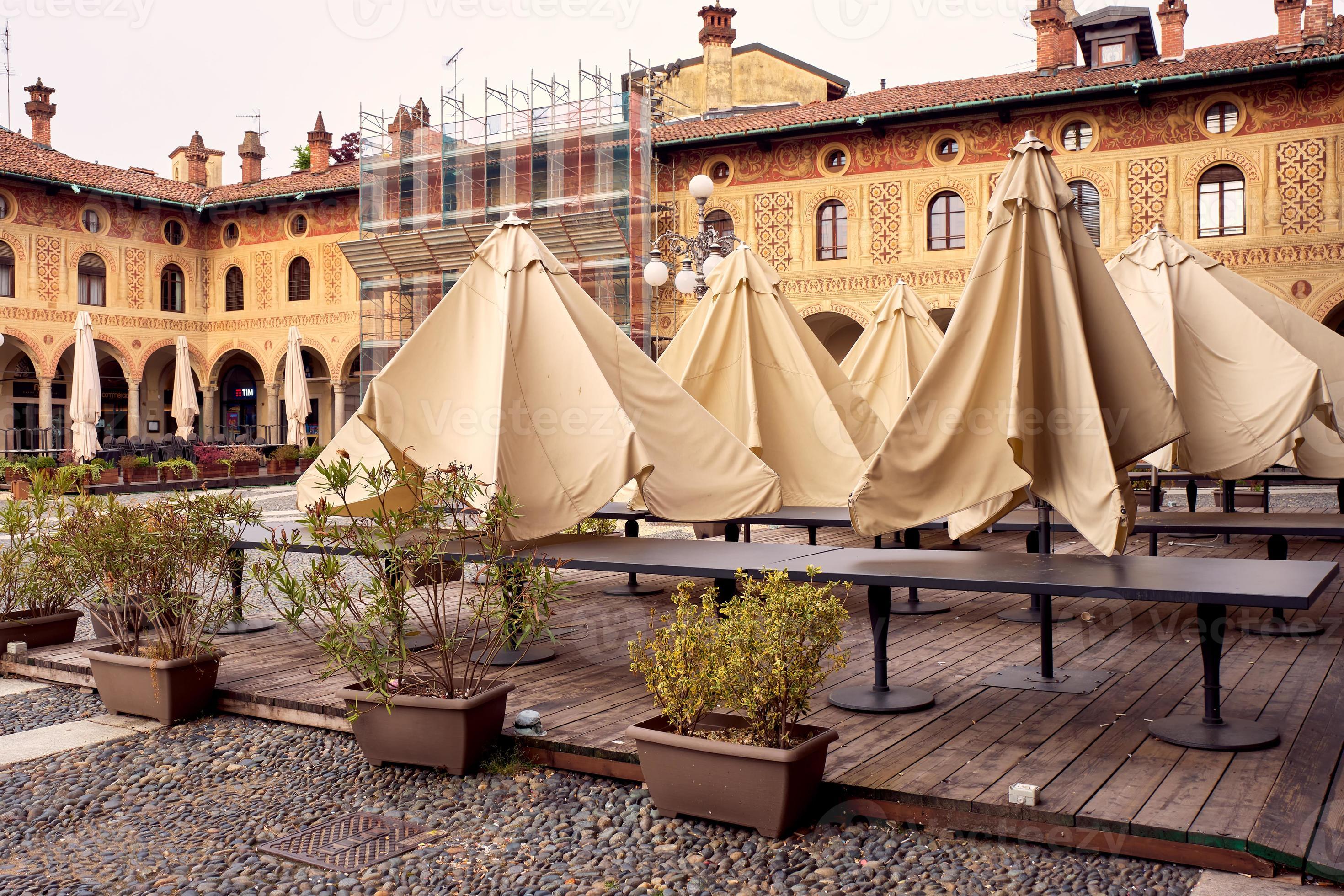 Tables and chairs in an outdoor restaurant in Vigevano photo