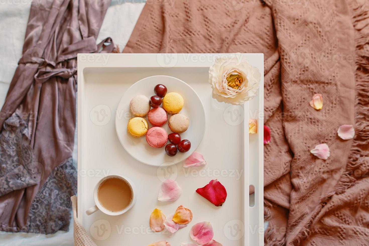 Romantic breakfast in bed with macaroons. photo